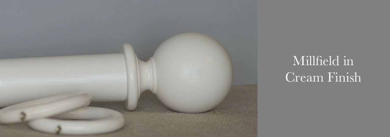 Page top banner – cream curtain pole with Millfield finial, pole, and wood ring assembly.
