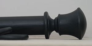 Black curtain pole with Orton finial and sample rings