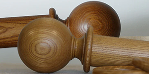 table top display of oak curtain poles