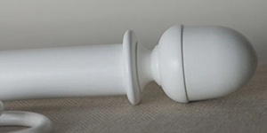 White curtain pole with acorn wood finial