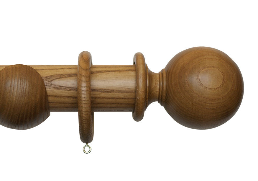 Product Image - Showing light oak curtain pole with a Millfield finial, ring and bracket pole set assembly.